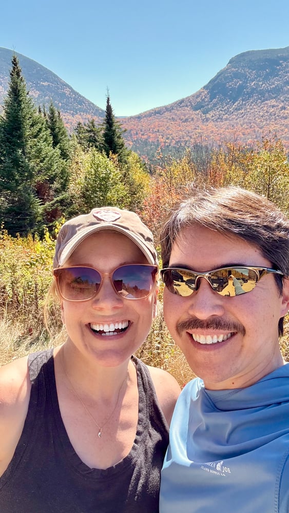 selfie of Rachelle and Pete with fall foliage