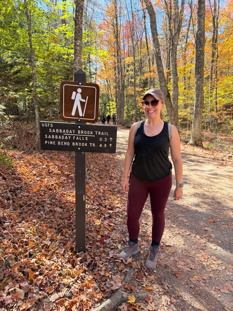 Rachelle standing next to sign to Sabaday Brook Trail