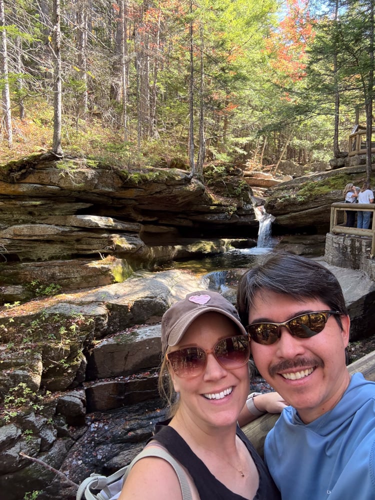 Rachelle and Pete taking a selfie in front of Sabaday Falls New Hampshire