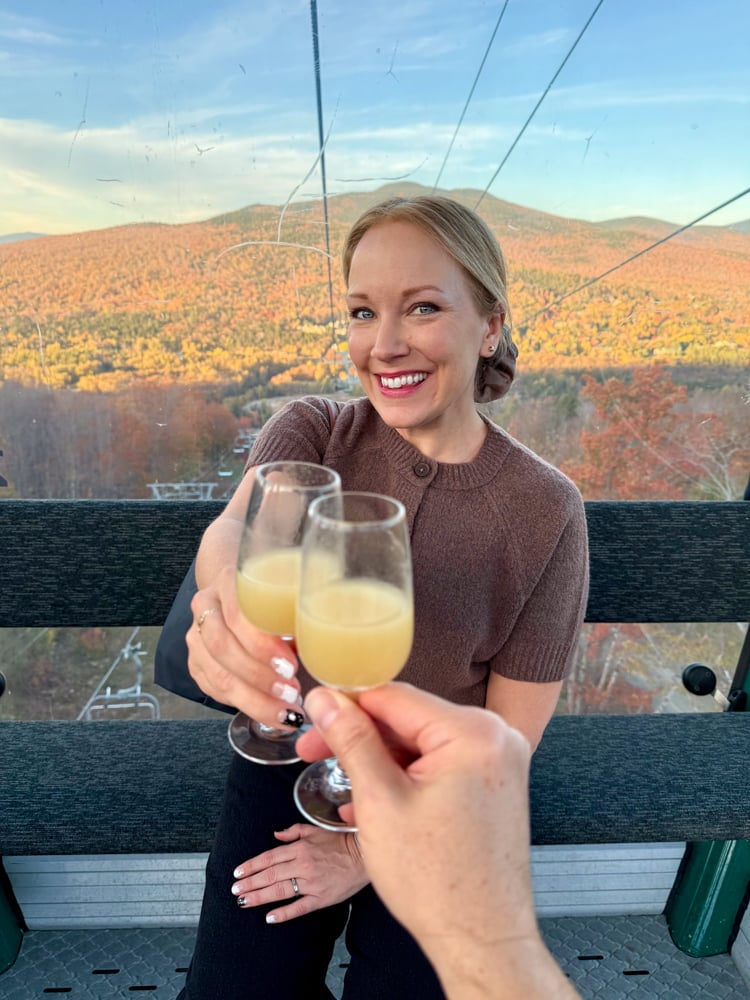 Rachelle on the gondola to Bretton Woods toasting with a class of juice