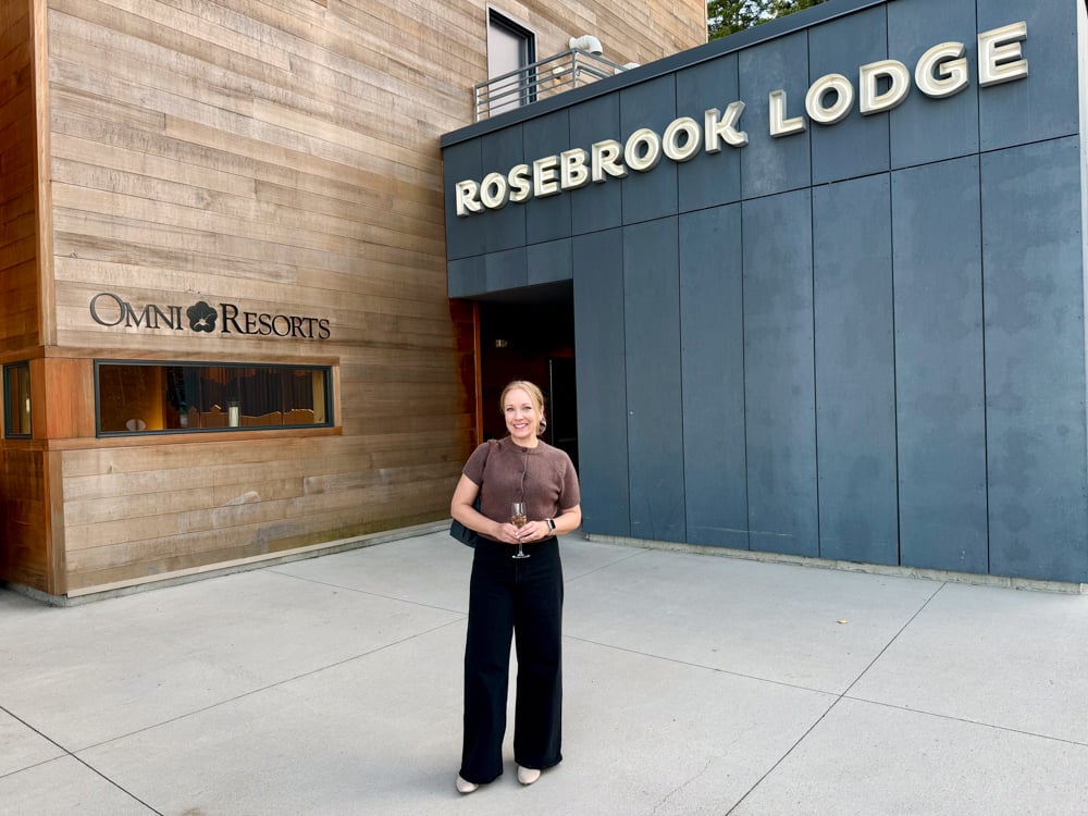 Rachelle in front of the Rosebrook Lodge at the Omni