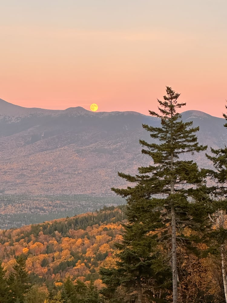 full moon rising over Mount Washington as seen from Bretton Woods