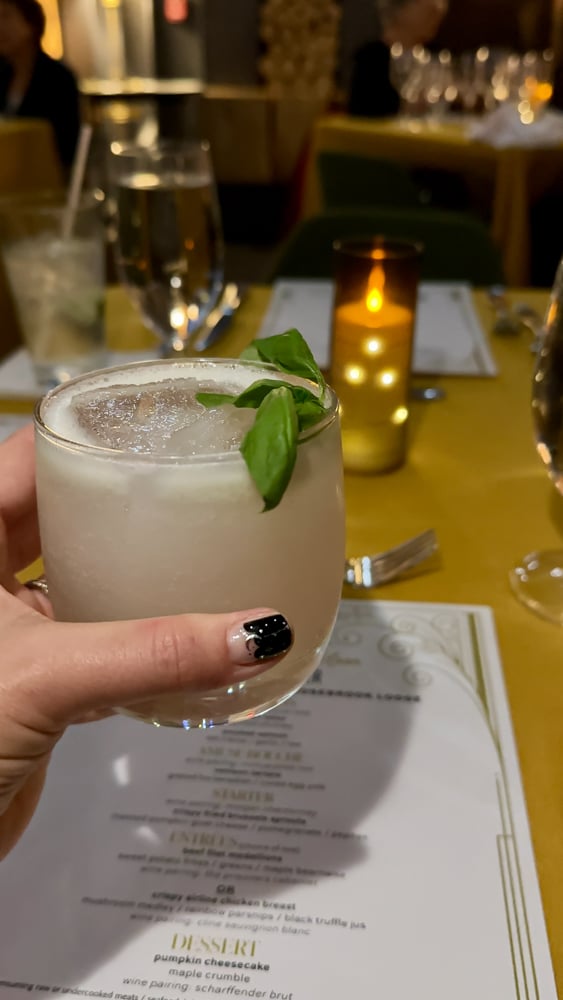 white cocktail with fresh basil