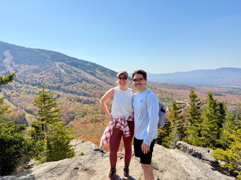 Wide shot of Rachelle and Pete at the top of Bald Mountain
