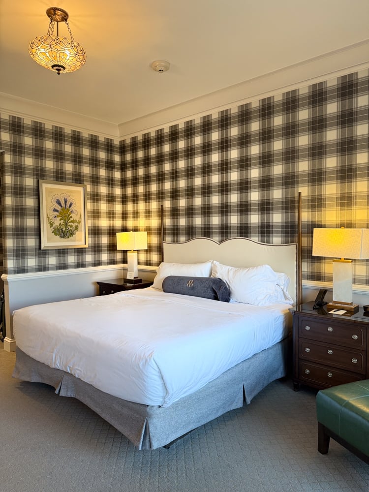 Bedroom with plaid wallpaper at Omni mount Washington