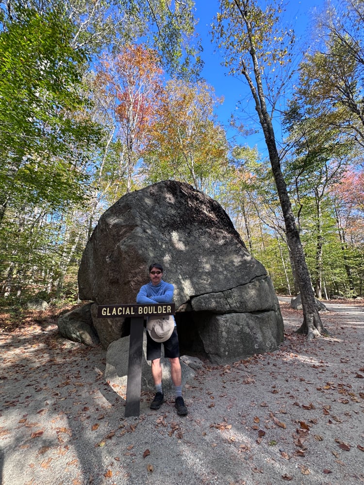 Pete standing in front of a Glacial Boulder at The Flume