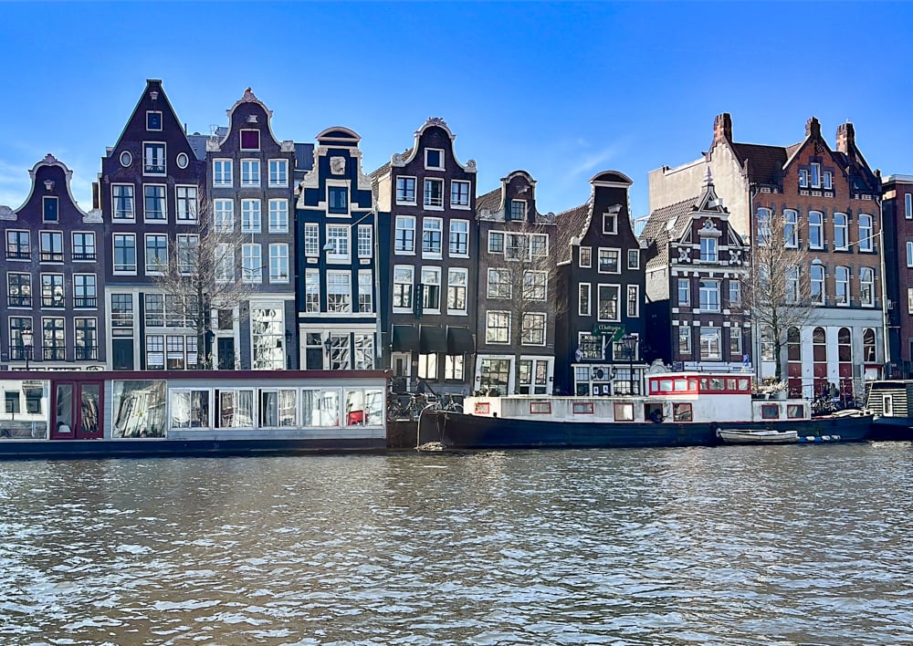 Historic canal houses along an Amsterdam canal