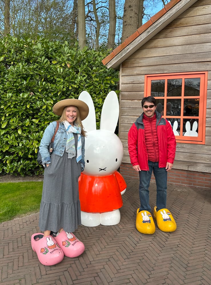 Rachelle and Pete posing with the cartoon bunny Miffy at Keukenhoff