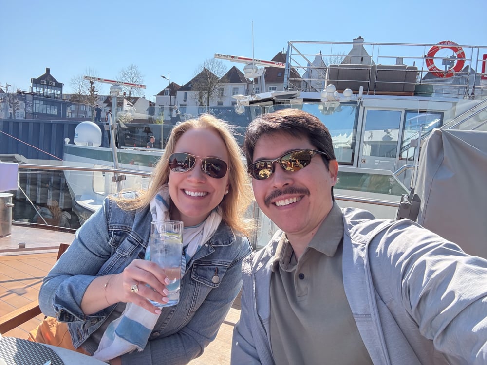 Rachelle and Pete on the deck of a Viking ship during a nice spring day